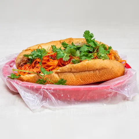 Grilled chicken bánh mì with pickled carrot, cilantro and jalapeño