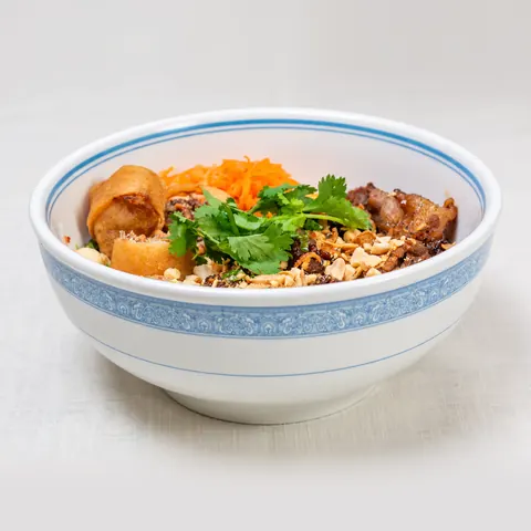 Grilled pork and egg roll vermicelli bowl with peanuts and herbs