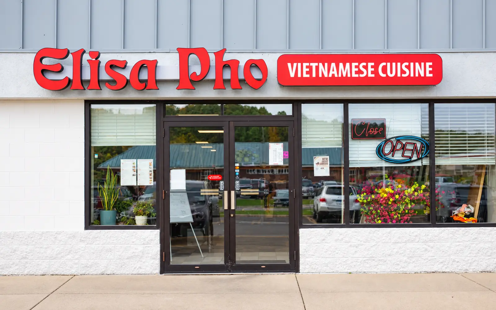 The Elisa Pho Vietnamese Cuisine storefront with its red sign on Schilling Drive in Dundas