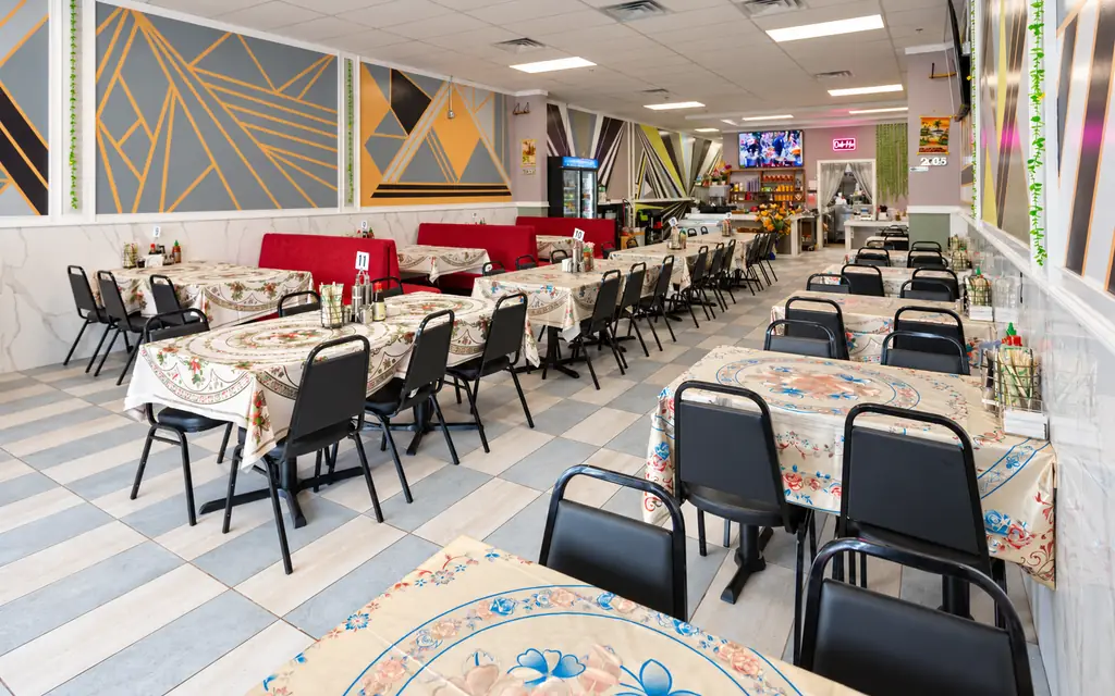 Tables and red booths in the Elisa Pho dining room